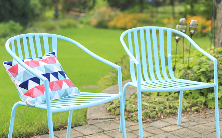 Two light blue patio chairs.